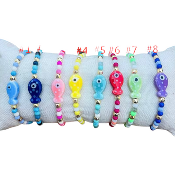 Tiny gold bead and glass fish bracelets